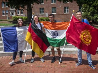 International Students Hold Flags from Countries of Origin