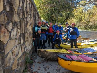 Students with kayaks